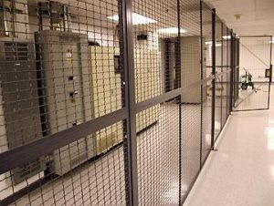 Secured data center cage with server racks behind