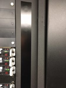 Black mag seal strip on data center server rack.
